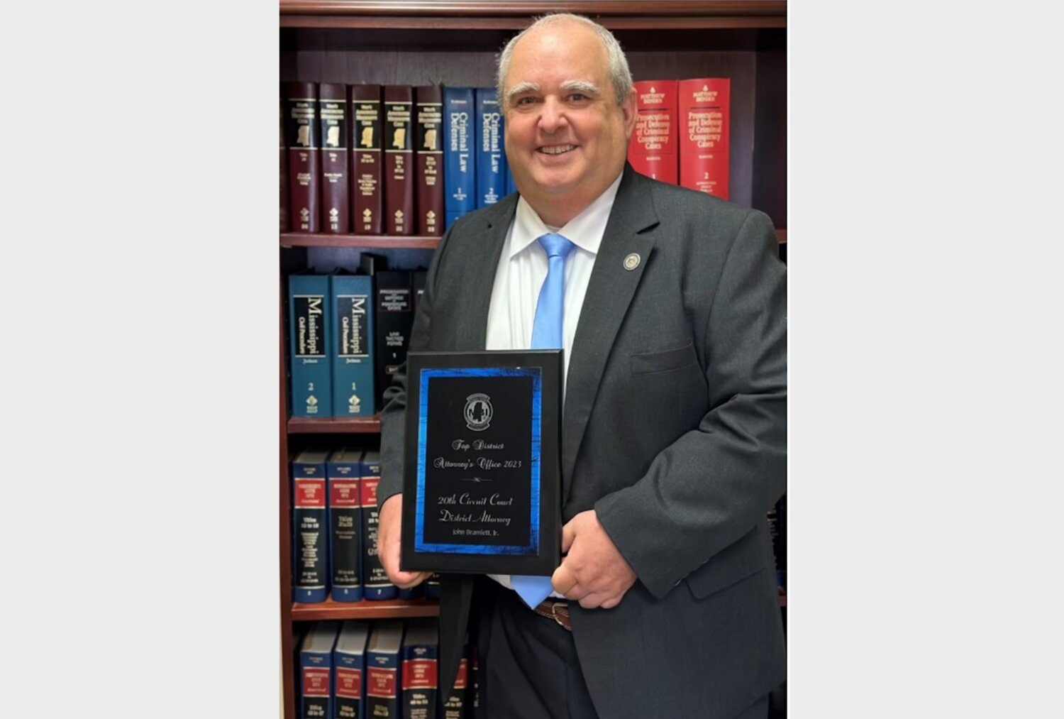 Pictured with the award is Bubba Bramlett, District Attorney for Madison and Rankin counties.